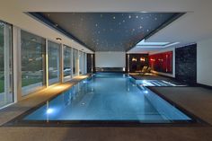 an indoor swimming pool in a modern home