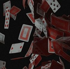 playing cards are falling down on the floor and in the air as if they were flying