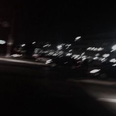 blurry photograph of city street at night