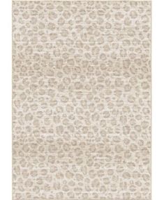 a beige and white rug with an animal print pattern on the bottom, in front of a