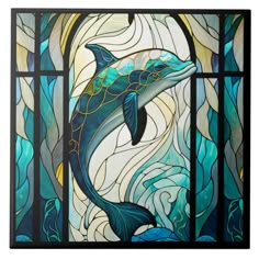 a stained glass window with a dolphin on it