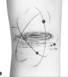 a black and white photo of an abstract tattoo