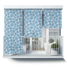 a blue and white wallpaper with flowers on it, in front of a window