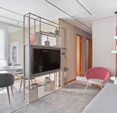 a living room filled with furniture and a flat screen tv