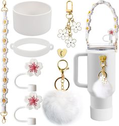 the contents of a white coffee cup are shown in this image, including key chains, bracelets, and other accessories