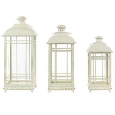 three white lanterns sitting next to each other