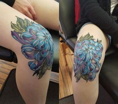 a woman's legs with blue flowers on them