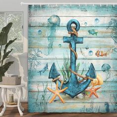 the shower curtain is decorated with an anchor and starfishs on blue wood planks