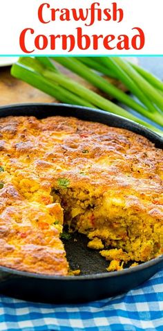 a close up of a pie in a pan with the words crawfish cornbread on it