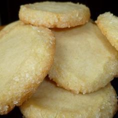 a pile of sugar cookies sitting on top of a table