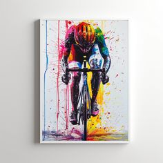 a painting of a man riding a bike with colorful paint splatters on it