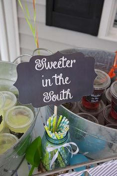 there is a sign that says sweeter in the south on top of some drinks