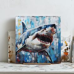 a painting of a great white shark on a shelf