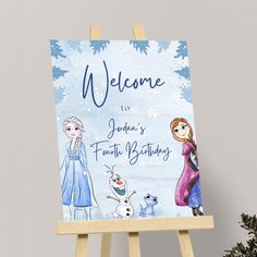 an easel with a frozen princess birthday card on it