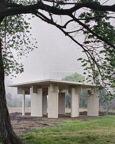 a concrete structure sitting in the middle of a field