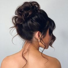 2. Effortless High Bun. High buns provide a great jumping-off point for wedding updos for medium hair, and you can get your version as soft and relaxed as this style. Prom Hairstyles Up Bun, High Messy Bun Updo Wedding, Prom Messy Bun Hairstyles, High Prom Bun, High Fancy Bun, Prom Updos Bun, Messy Bun Updo Prom, High Prom Updos, 90s High Bun Wedding