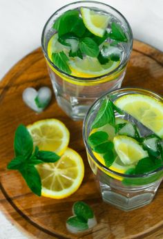 two glasses filled with lemon and mint water