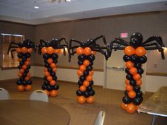 balloons are arranged in the shape of black and orange spider's, with one balloon attached to it