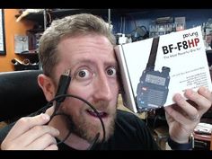 a man holding up a radio in front of his face