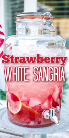 strawberry white sangria in a glass jar with ice