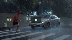 a man running across a street in front of a car on a rainy day,