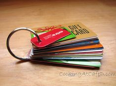 a stack of credit cards sitting on top of a wooden table