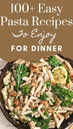 a skillet filled with pasta and broccoli on top of a wooden table