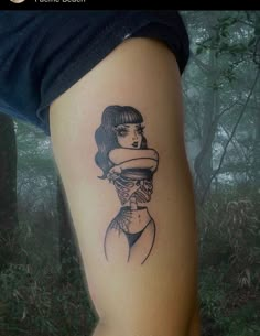 a woman with a hat on her head is shown in black and white tattoo art