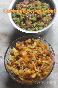 two bowls filled with food on top of a table