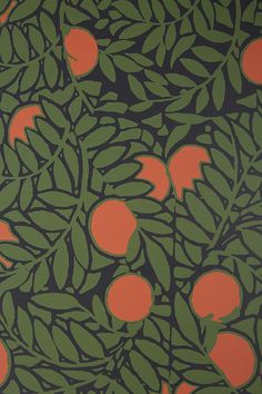 an orange and green wallpaper with leaves and fruit on it, in a room