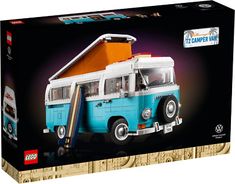 a blue and white vw bus with an orange roof is in a box on a white background