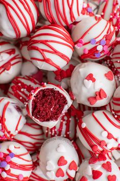 red and white chocolate covered desserts with sprinkles in the shape of hearts