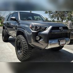 the front end of a gray toyota 4runner