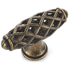 an antique brass finish door knob with latticed design on the front and back side