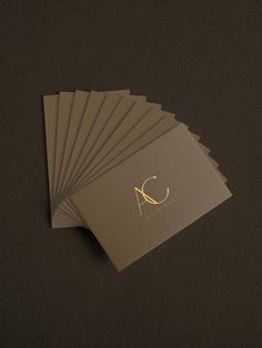 six business cards with the letter c on one side and an initial on the other