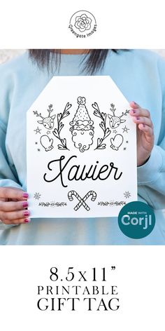 a woman holding up a sign with the name kauerr on it in front of her