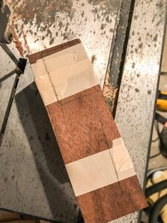 a piece of wood sitting on top of a table