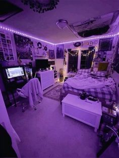 a bedroom with purple lights and pictures on the wall