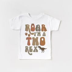 a toddler t - shirt with the words roar in two colors and an image of a dinosaur