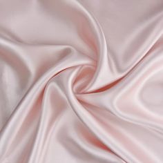 a close up view of a pink satin fabric