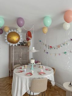 a dining room with balloons and decorations on the wall