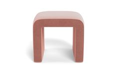 a small pink stool sitting on top of a white floor