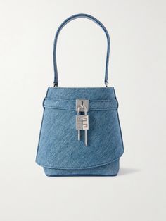 Givenchy's 'Shark Lock' bucket bag is named for the unique silver-tone fastening securing the front. It's been crafted in Italy from hardwearing denim, affixed to a leather-trimmed, curved top handle, and comes with a detachable shoulder strap. Inside, there's enough space for all your small essentials. Denim Bucket Bag, Givenchy Shark, Cult Gaia Bag, Tods Bag, Men Dior, Flat Dress Shoes, Drawstring Bucket Bag, Raffia Bag, Givenchy Women