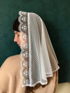 "A beautiful catholic veil is made of fine silky lace. Magnificent chapel of white color. Magnificent chapel is white. The edges of the chapel are covered with beautiful sewing, which gives tenderness and refinement. The length of the veil is 40 \"(100cm), width 21\" (53cm) Mantilla can be made in other sizes on request. Mantilla lace is suitable for  mass, the first Holy Communion and a gift for the mother. If you want any alterations its possible, just ask me and we will find any options. If you have any questions please contact with me. Directions for use: Rinse by hand and dry on a smooth surface. Do not iron." Catholic Wedding Veil, Catholic Veiling, Christian Veils, Chapel Veils, Chapel Veil Catholic, Veil Mantilla, Catholic Veil, Wedding Shawls, Veil Cathedral