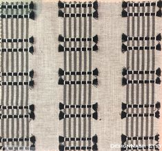 two rows of black and white fabric with small pins on them, all lined up together