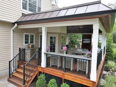 a small house with a deck and covered patio