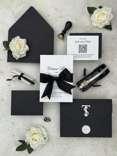 black and white wedding stationery with monogrammed envelopes, calligraphy and flowers