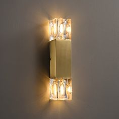 a light that is on the side of a wall with lights attached to it's sides