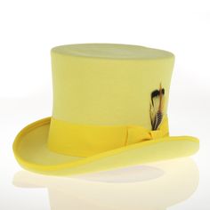 This distinguished and elegant classic formal top hat will add timeless style to any outfit. Constructed of 100 percent wool felt, this hat is finished with grosgrain ribbon trim and has a fully lined plush interior. Features: 100% Wool Felt Reinforced Brim & Crown for ultimate longevity Grosgrain Ribbon & Feather Accent Crown: 7 inches high Brim: 2 inches Classic Wide Brim Hat For Royal Ascot, Ribbon Feather, Formal Top, Formal Tops, Instagram Men, Ribbon Trim, Wool Dress, Dress Top, Top Hat