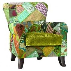 an upholstered green chair with patchwork fabric